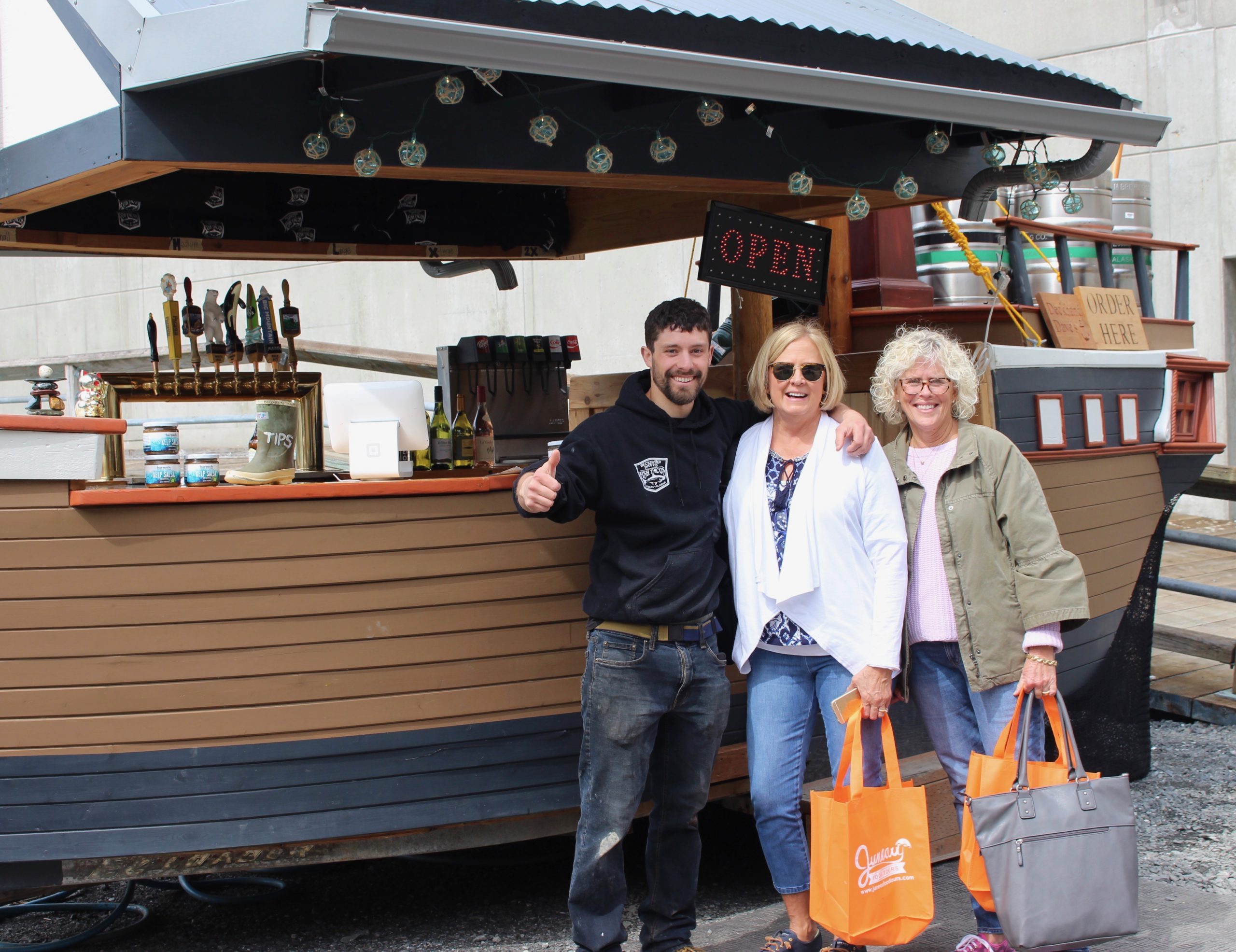 Dave of Deckhand Dave's standing with Juneau Food Tours' guests.