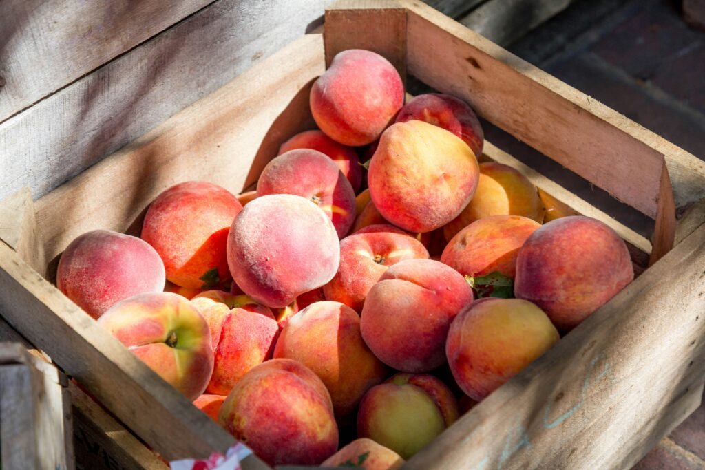 This basket of peaches is a good reminder that Life sure is peachy! Photo by LuAnn Hunt via Upsplash.